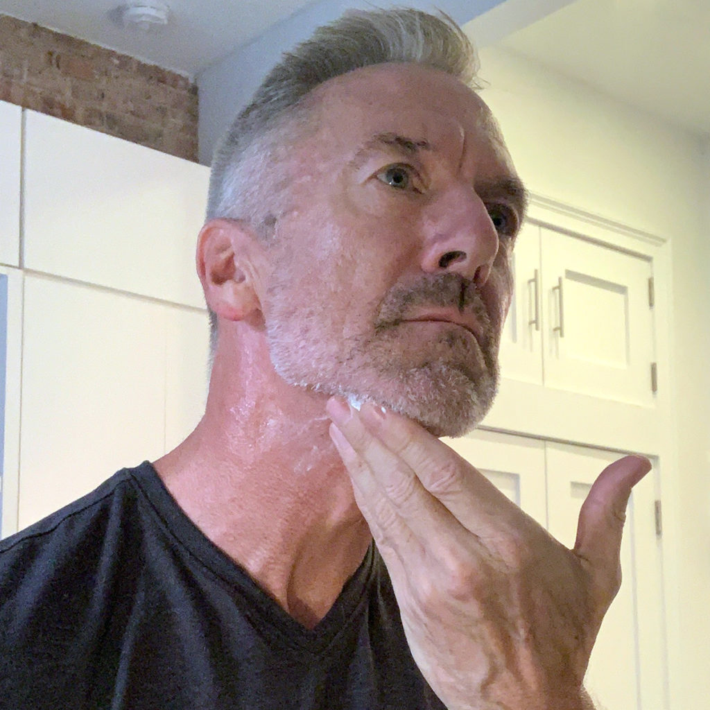 Man applying Particle Neck Cream 1