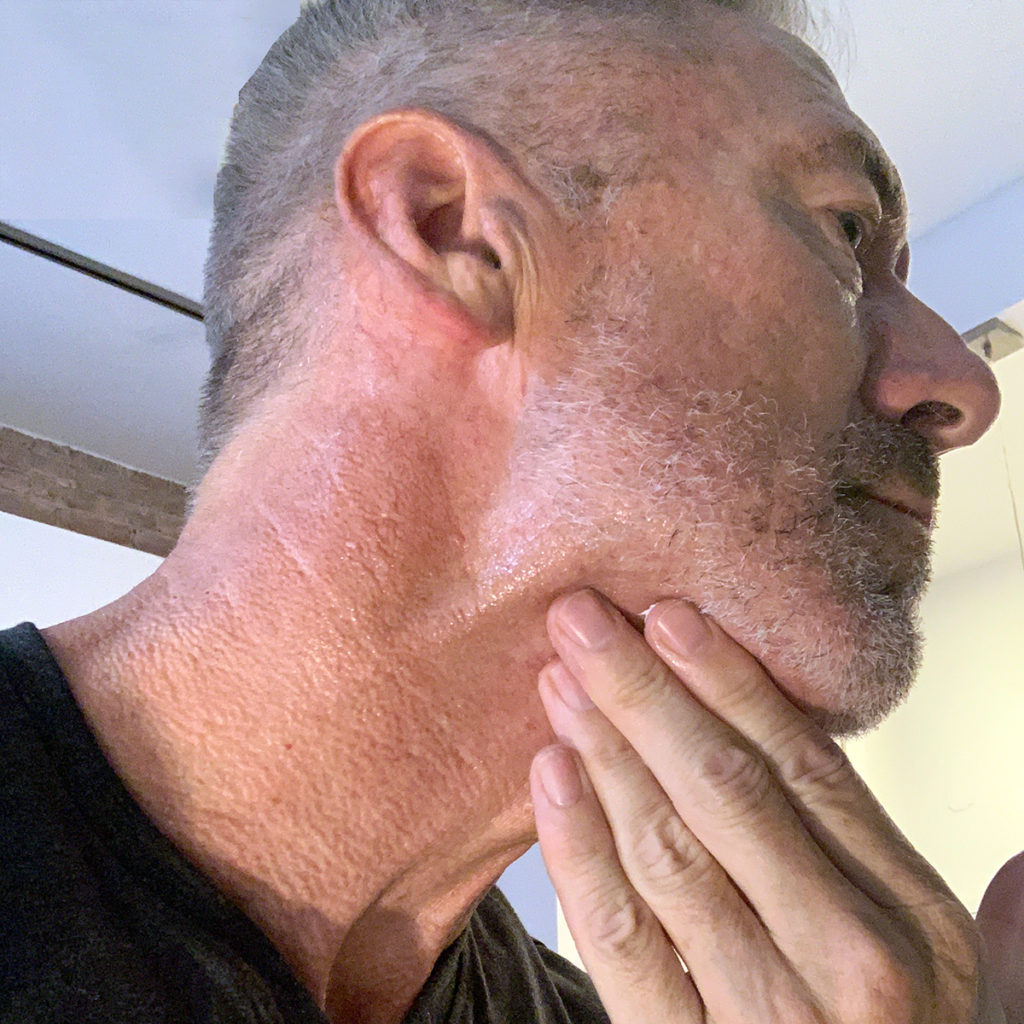 Man applying Particle Neck Cream 2