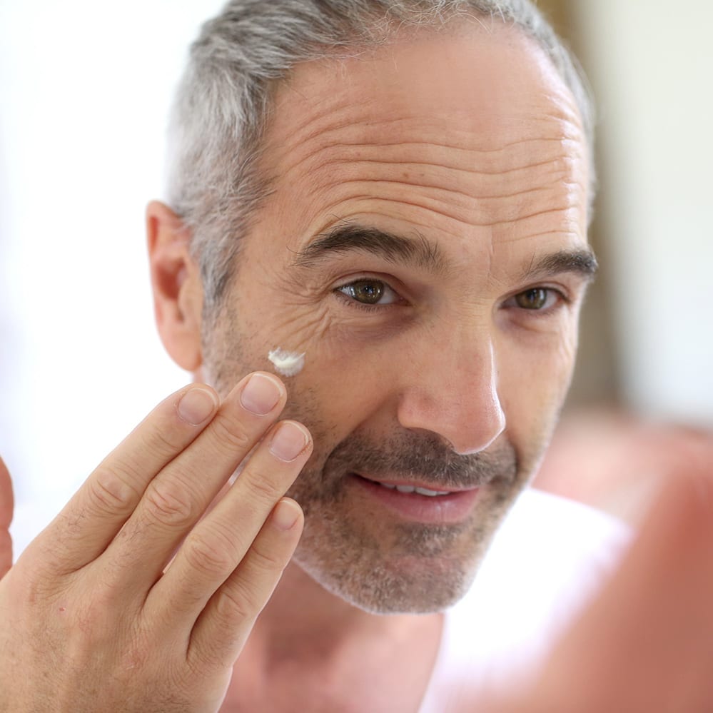 Man applying face cream