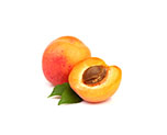Two apricots, one whole, one halved, showing the pit inside
