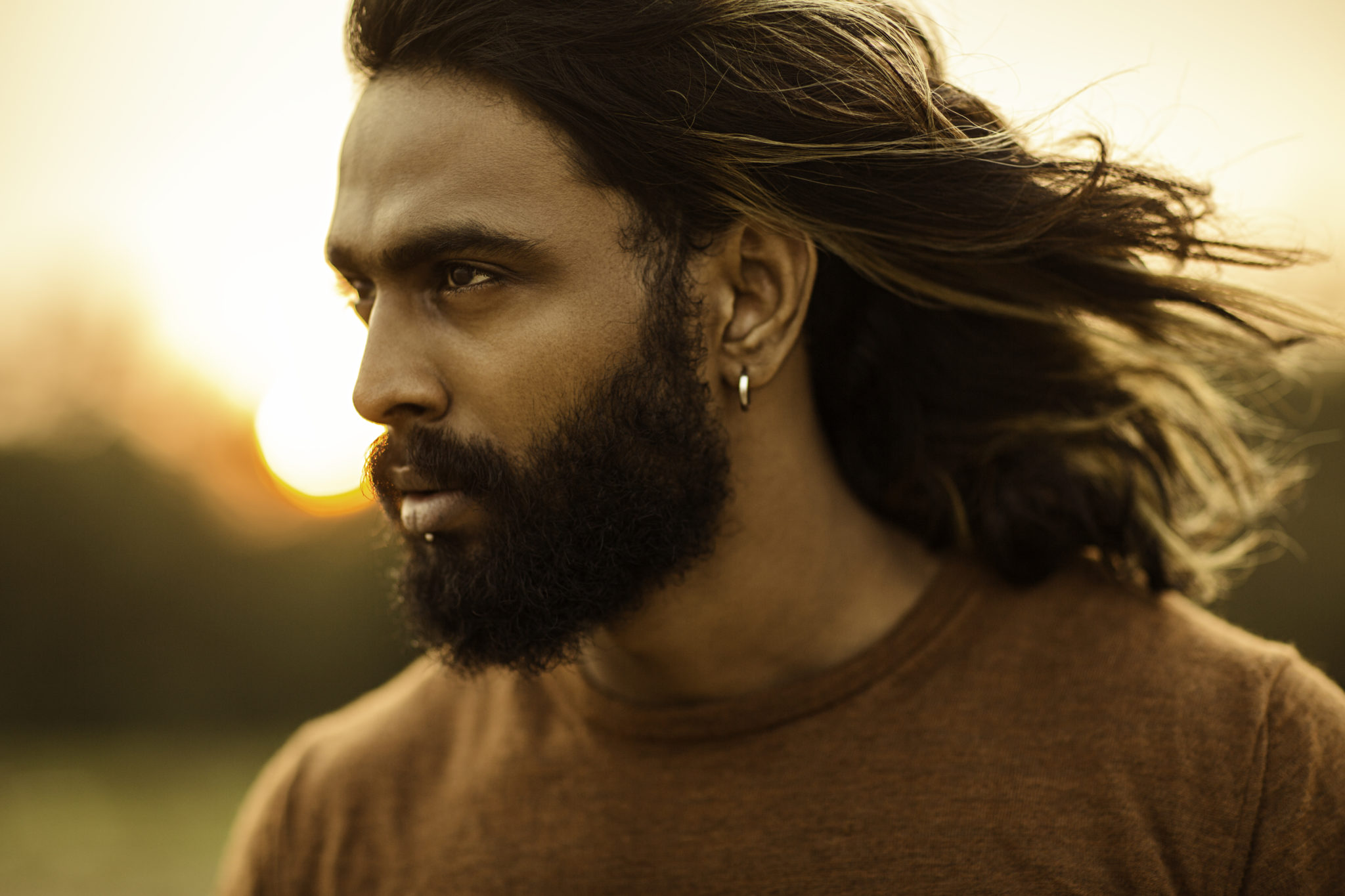 Long,Hair,Bearded,Young,Man,Portrait,Enjoying,Breezy,Wind,In